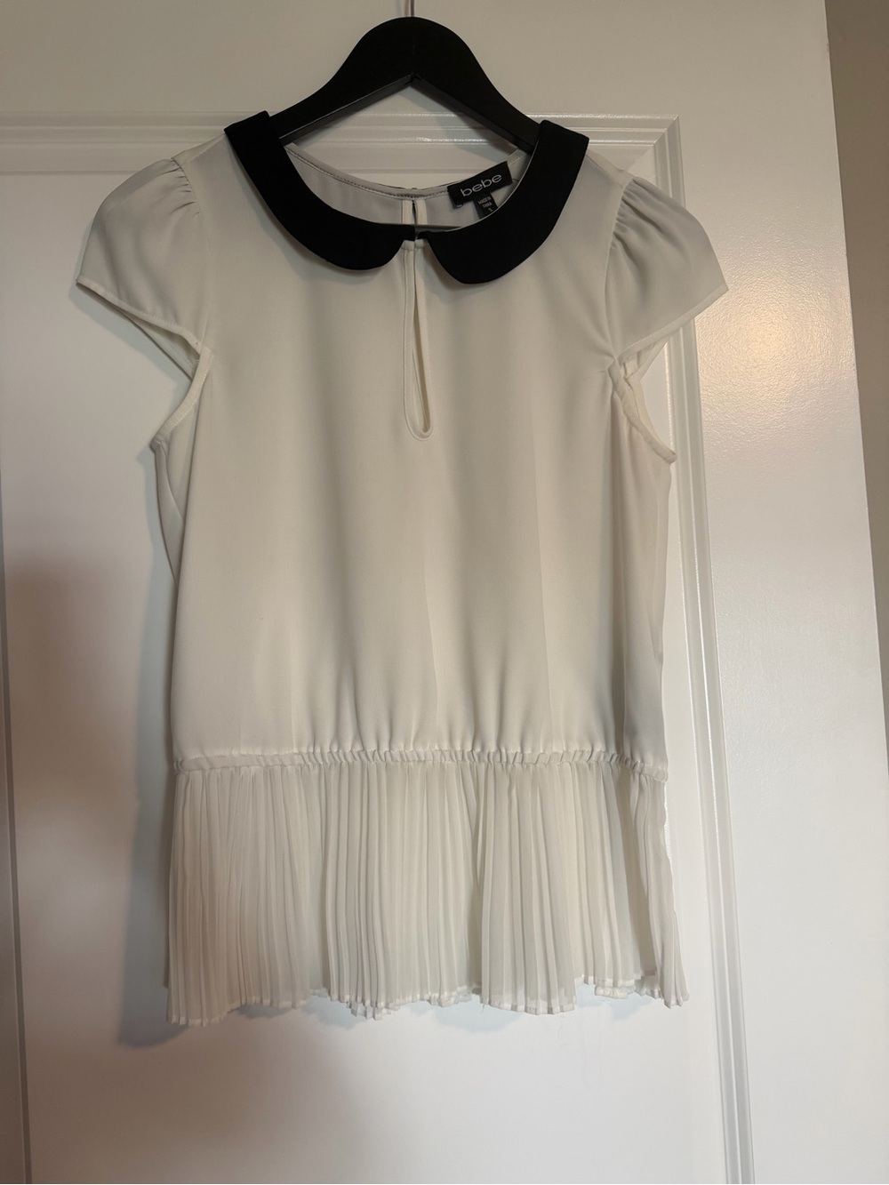 bebe White Blouse with Black Peter Pan Collar and Pleated Hem